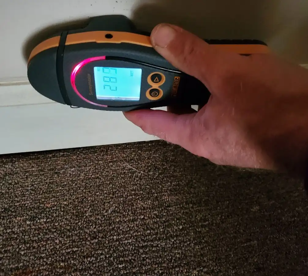 Moisture detection at baseboard during Storm Damage Restoration in McKinleyville